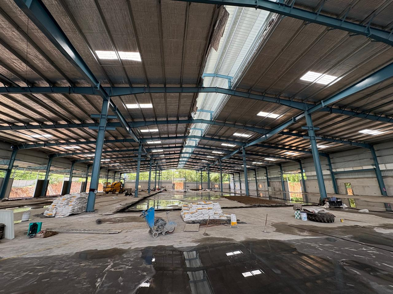 Interior view of a high-capacity PEB warehouse design featuring optimized clear heights and maximum storage volume for industrial logistics