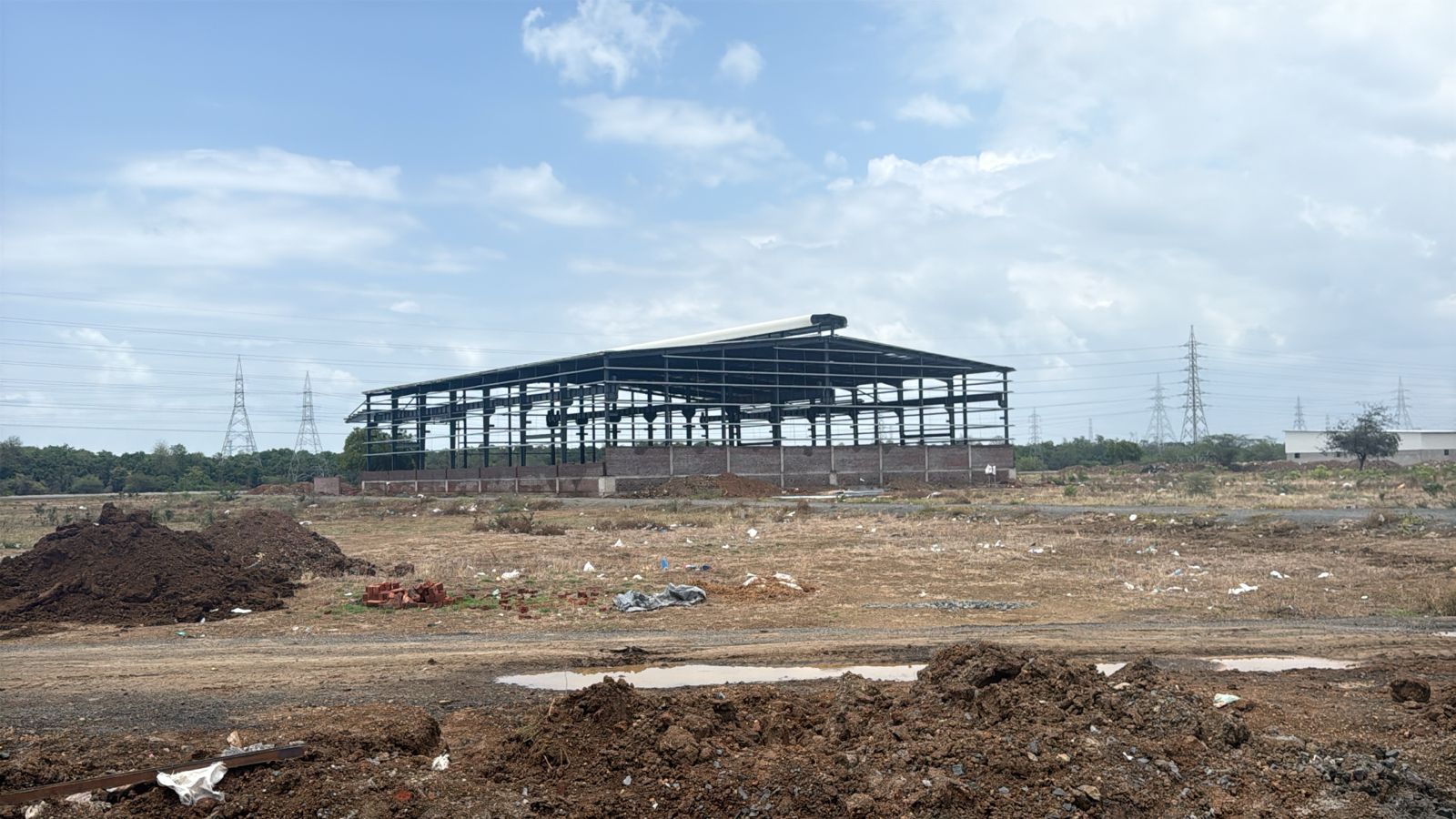 Erection of Structural steel framework for a pre-engineered industrial building designed by PEB structural engineering consultants.